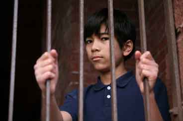Boy-behind-bars
